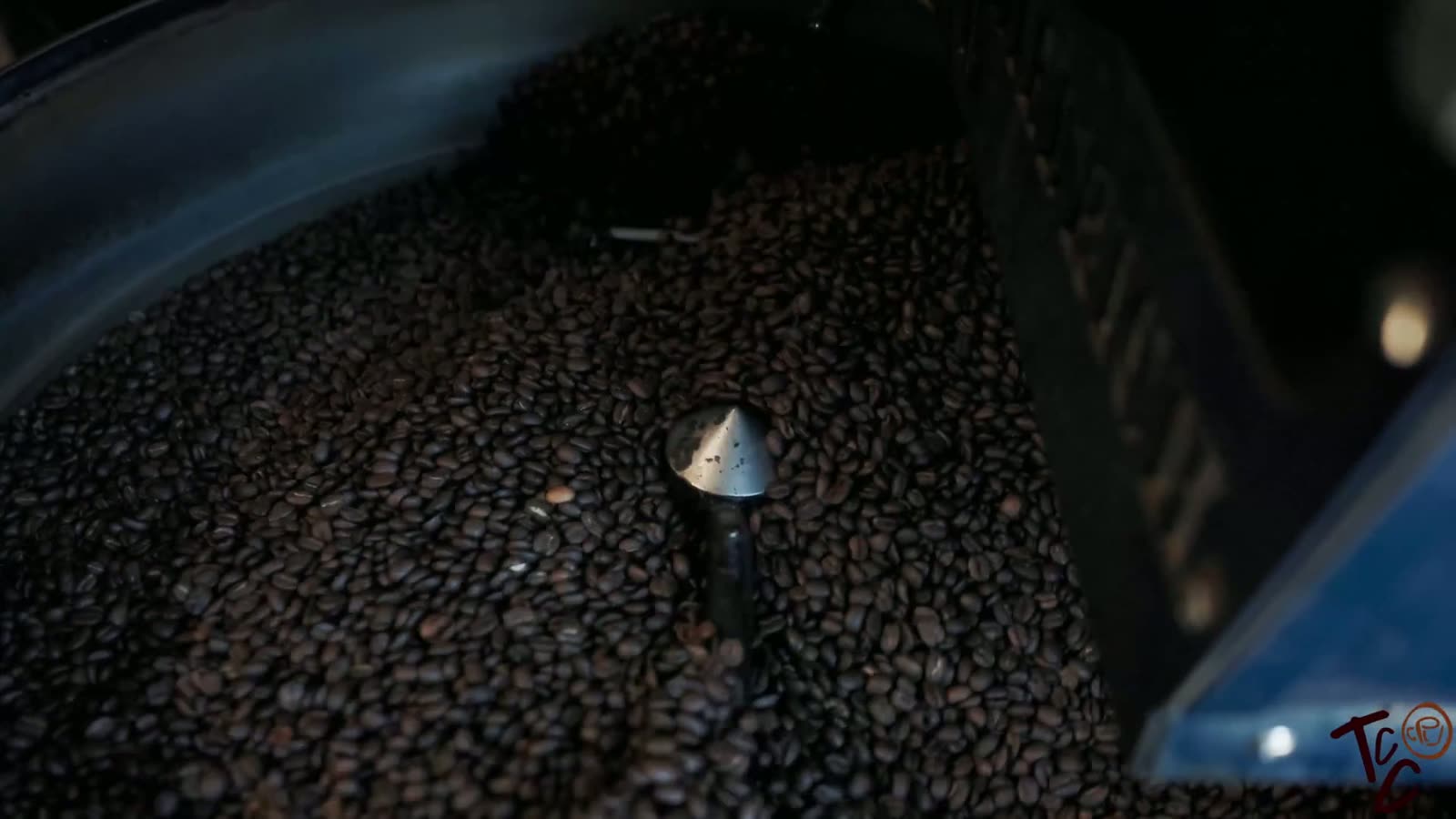 Freshly roasted beans turning in the roaster